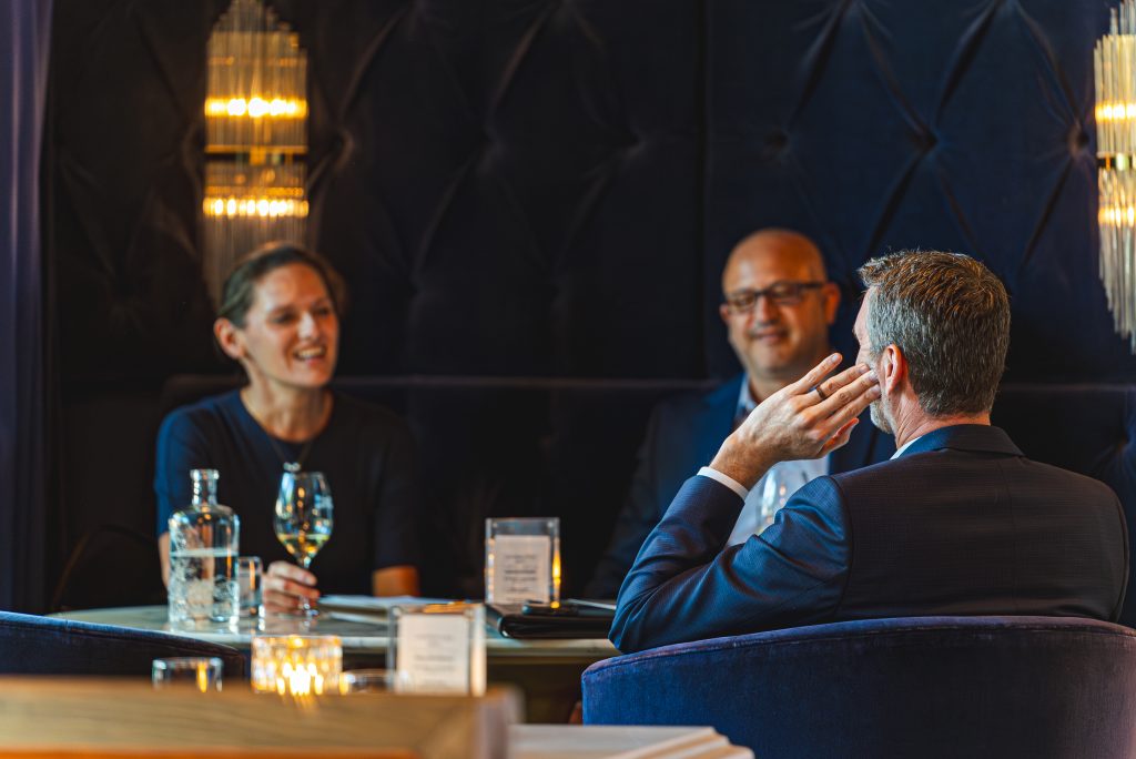 Elegant private club dining room with sophisticated ambiance and refined furnishings